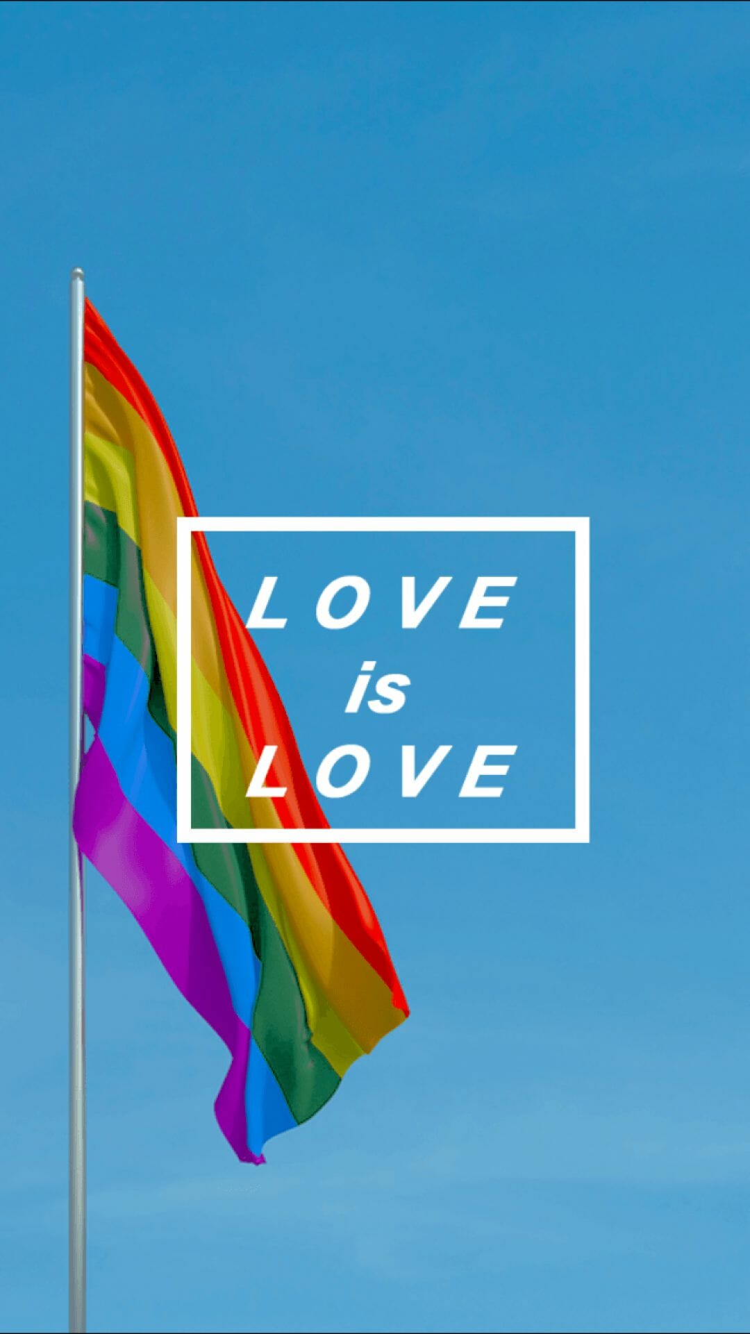 A rainbow flag with the words love is above it - LGBT, pride