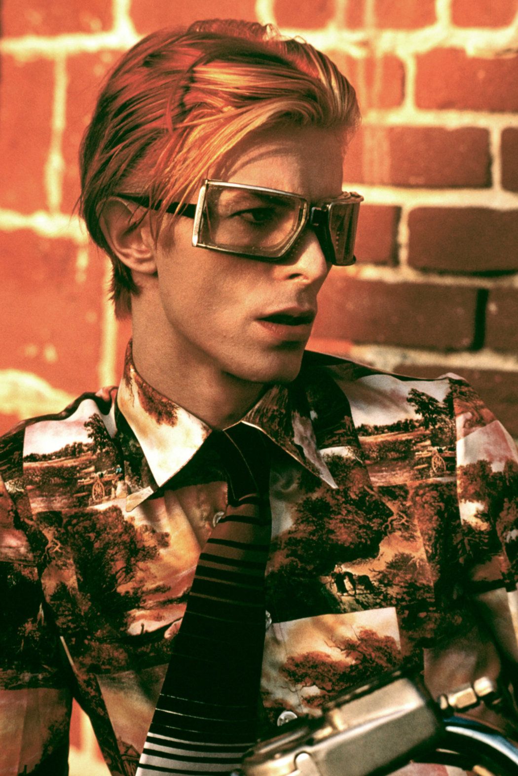 David Bowie with his iconic style and glasses - David Bowie