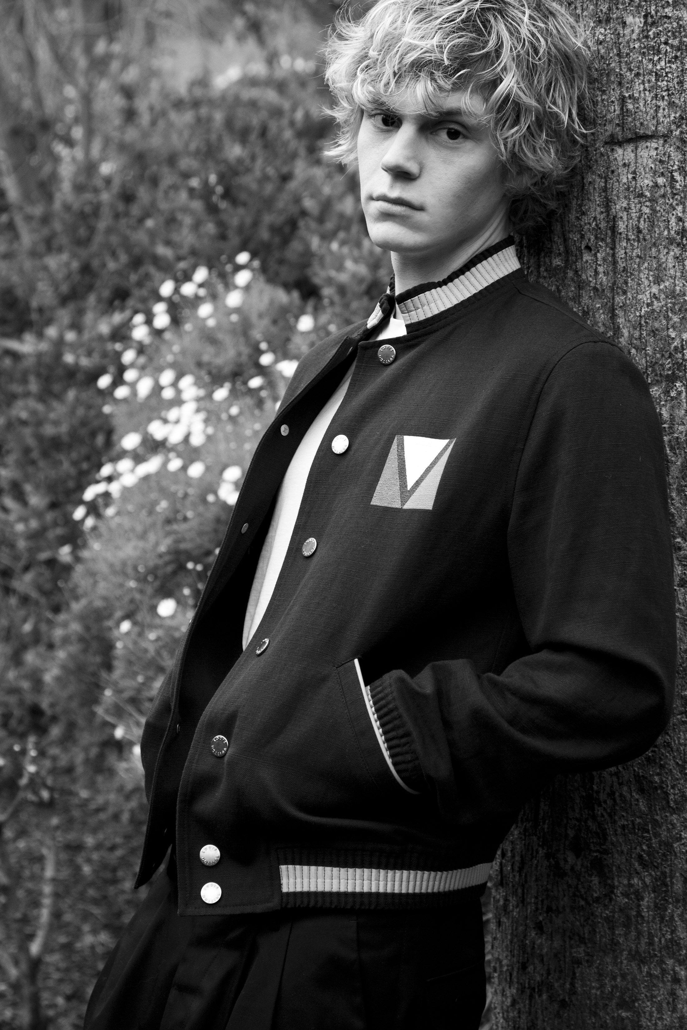 A young man wearing an old fashioned jacket - Evan Peters