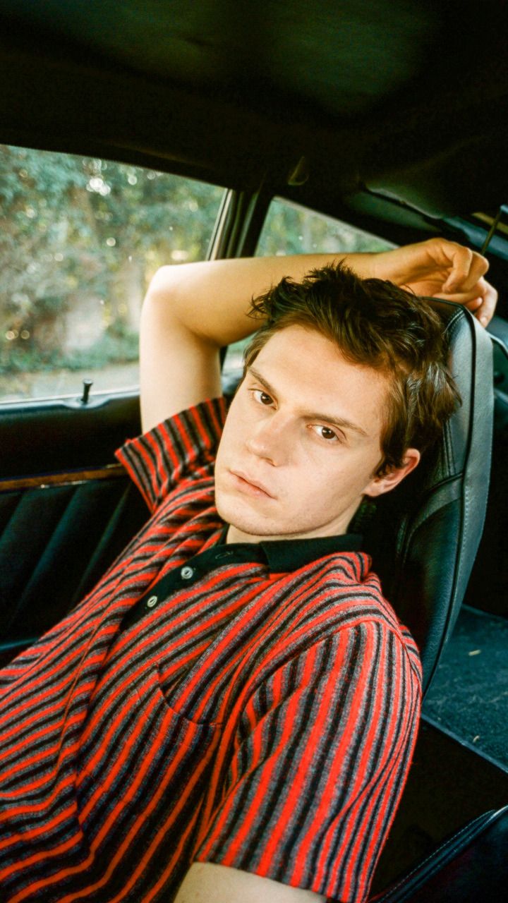 A man in the back of his car - Evan Peters