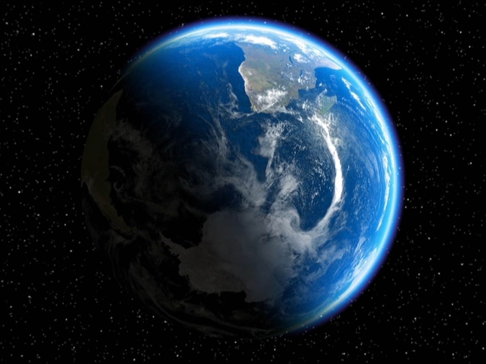 The earth is shown in space with a blue atmosphere - Earth