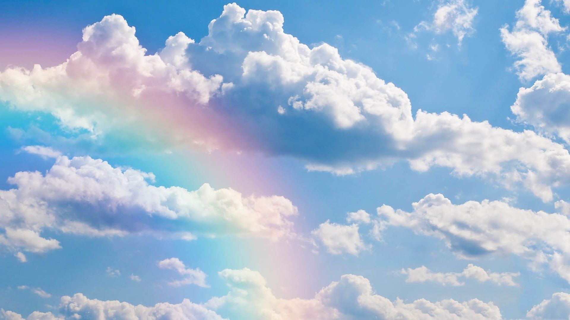 A rainbow appears in the sky above the clouds - Cloud, vintage clouds