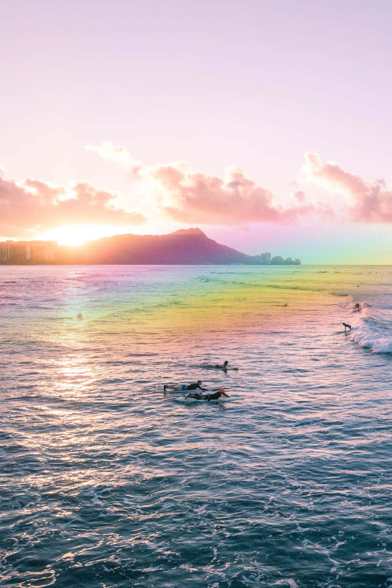 A rainbow in the sky over some water - Hawaii