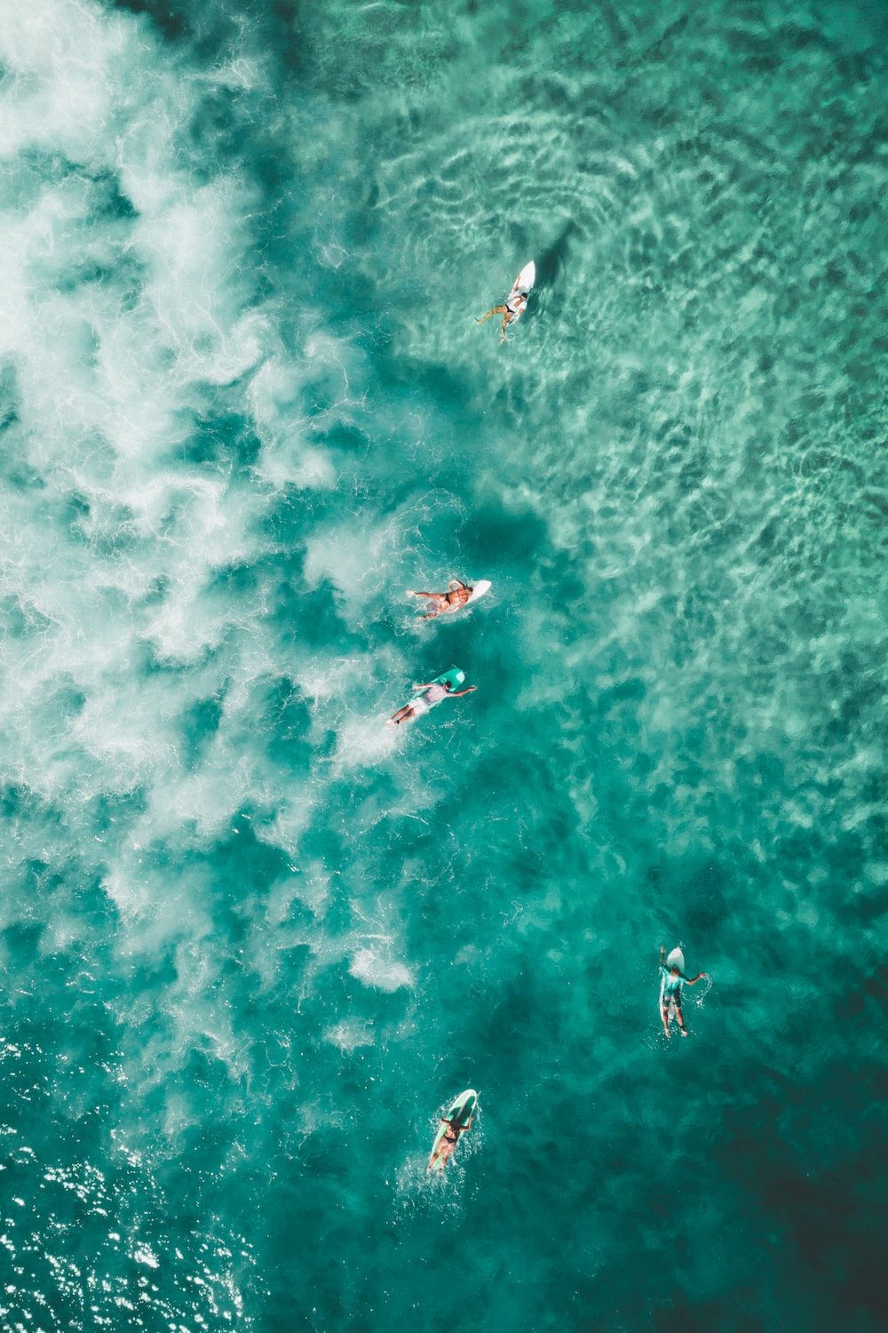 As a group of surfers in the ocean - Surf