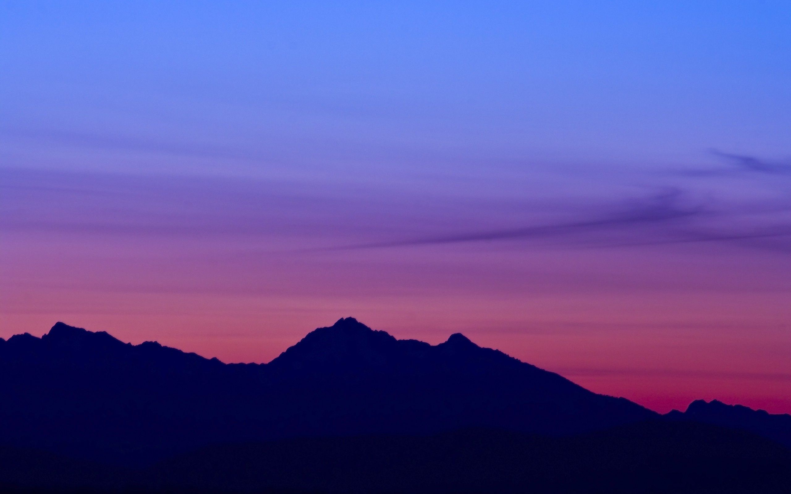 A sunset with mountains in the background - Mountain, landscape