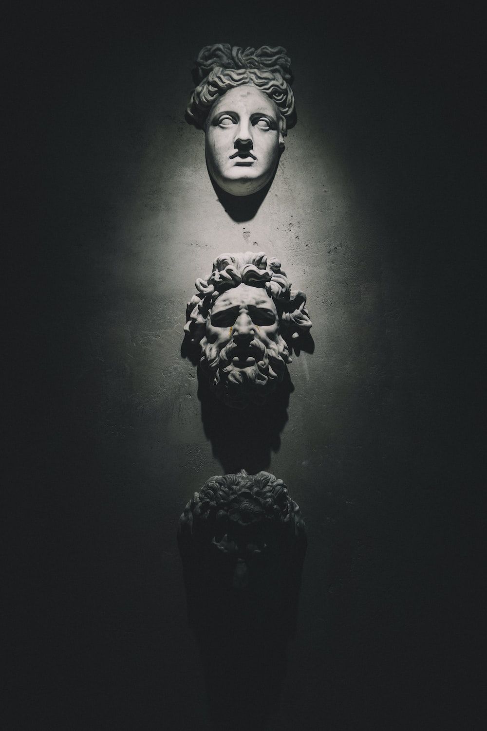 A group of heads on the wall - Greek mythology, Greek statue