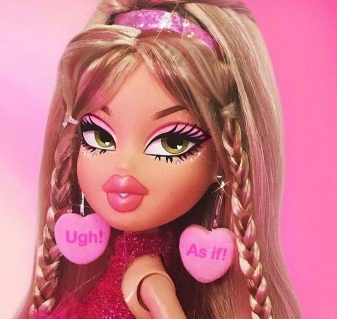 A barbie doll with pink hair and heart shaped earrings - Bratz