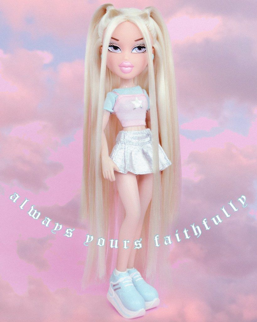 A doll with blonde hair and blue eyes - Bratz
