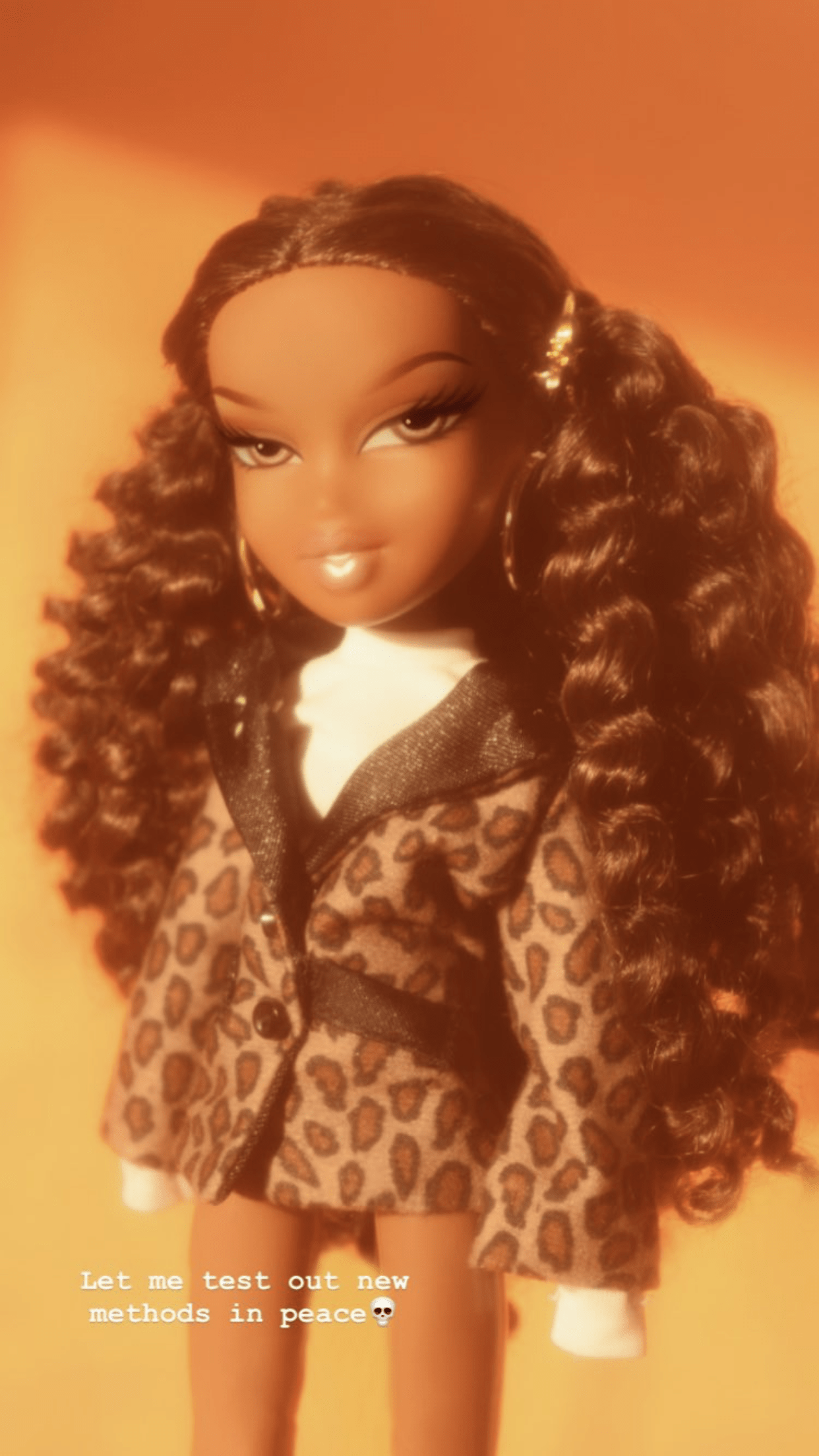 A doll with curly hair and leopard print clothing - Bratz
