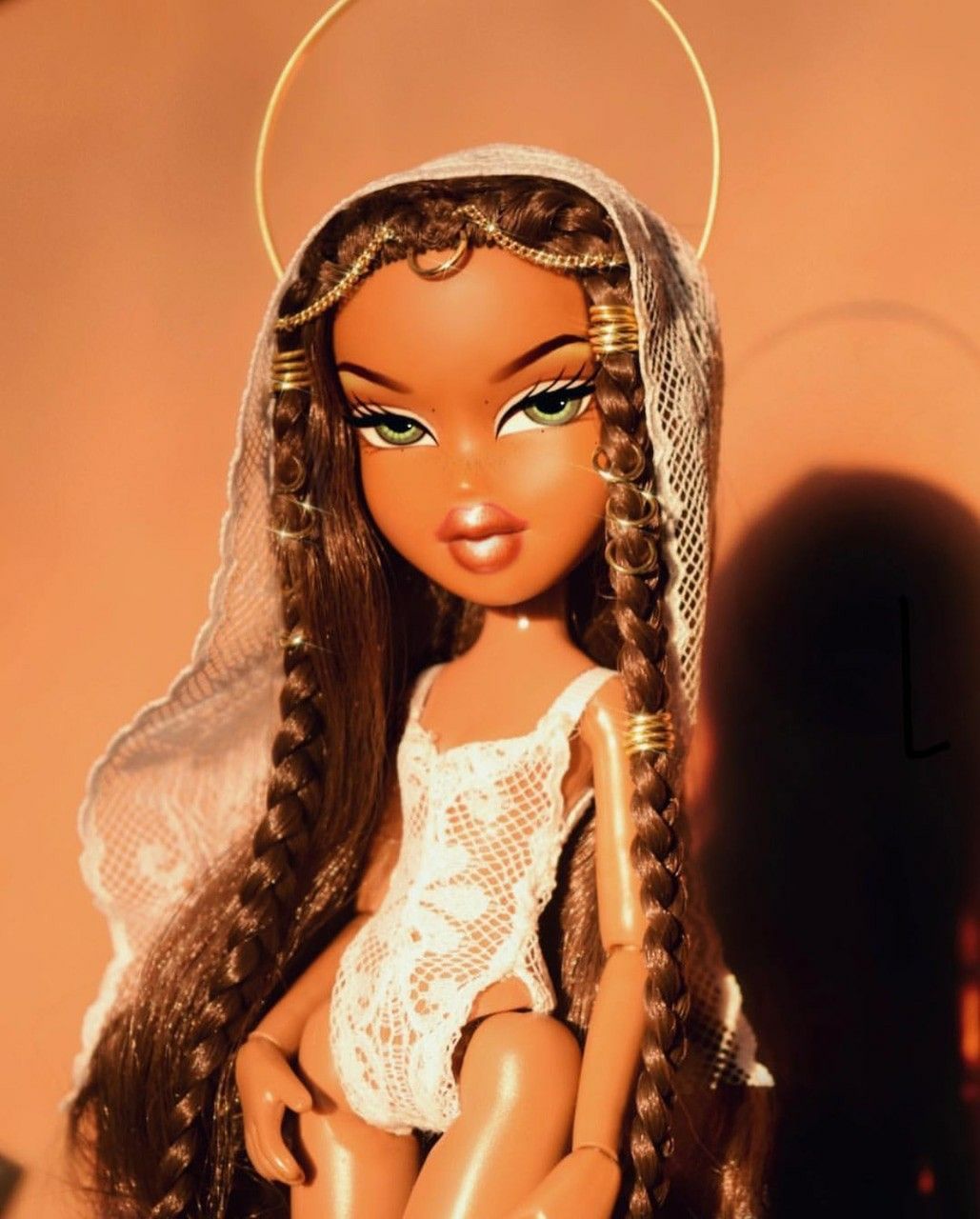 A doll with long hair and a white veil - Bratz