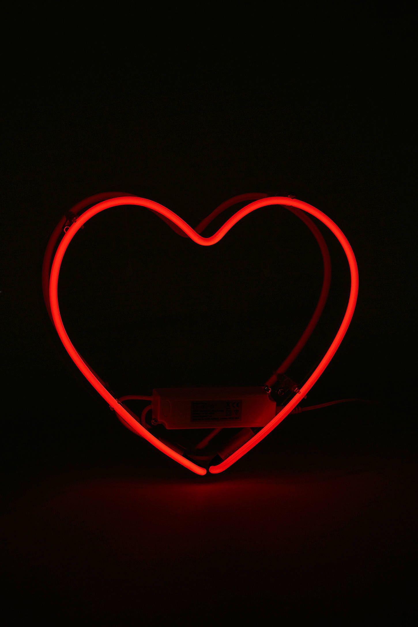 A red heart shaped light is on - Light red, neon red