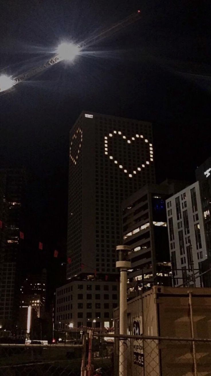 A tall building with lights that look like hearts - Heart, black heart, TikTok