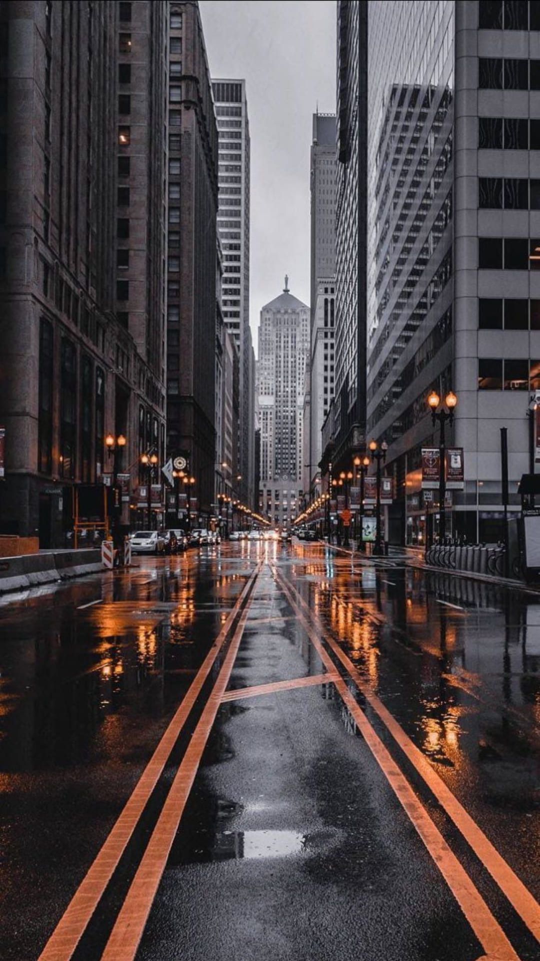A street with rain and cars on it - New York, city, road