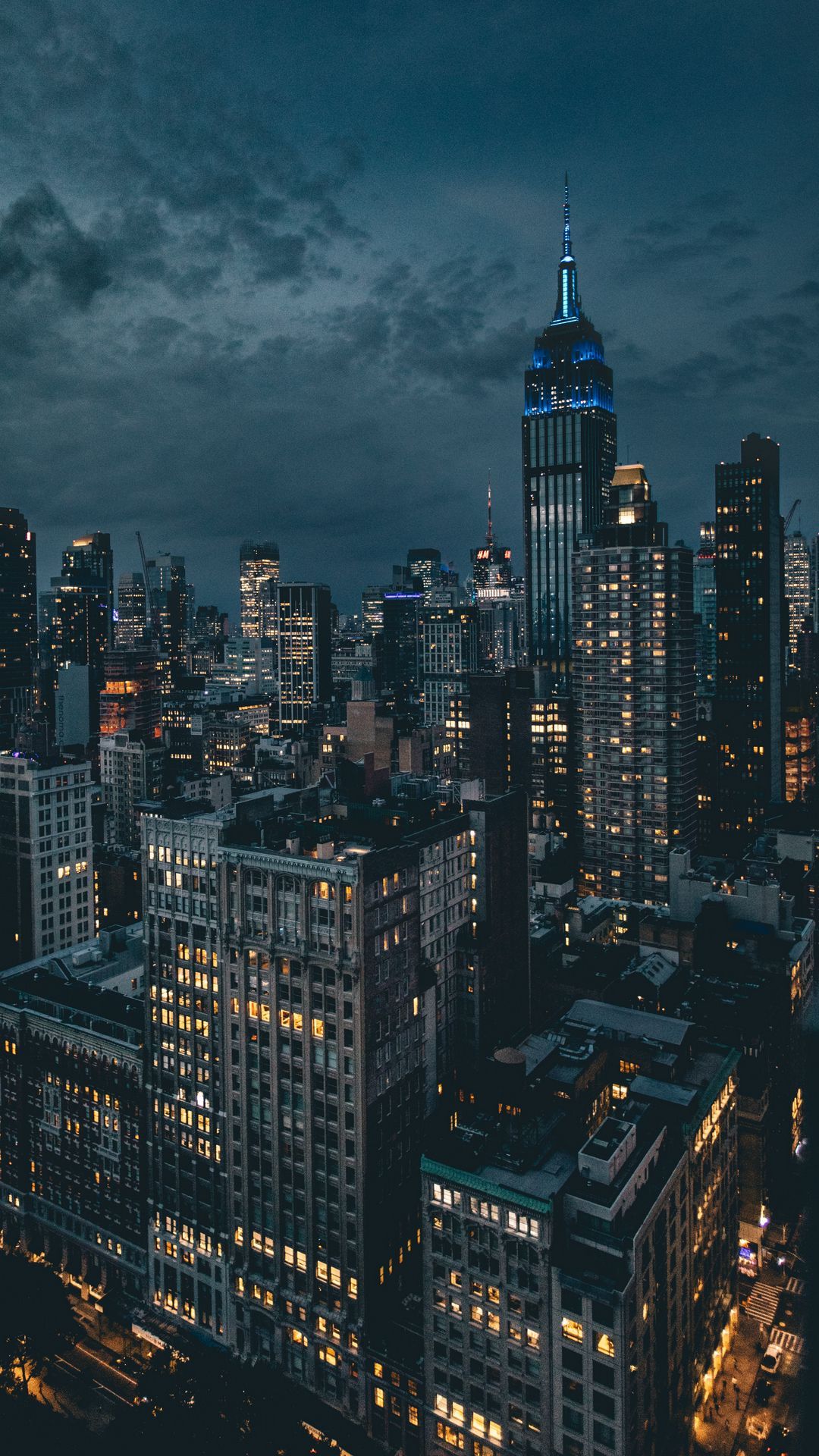 A city skyline at night with buildings and lights - New York