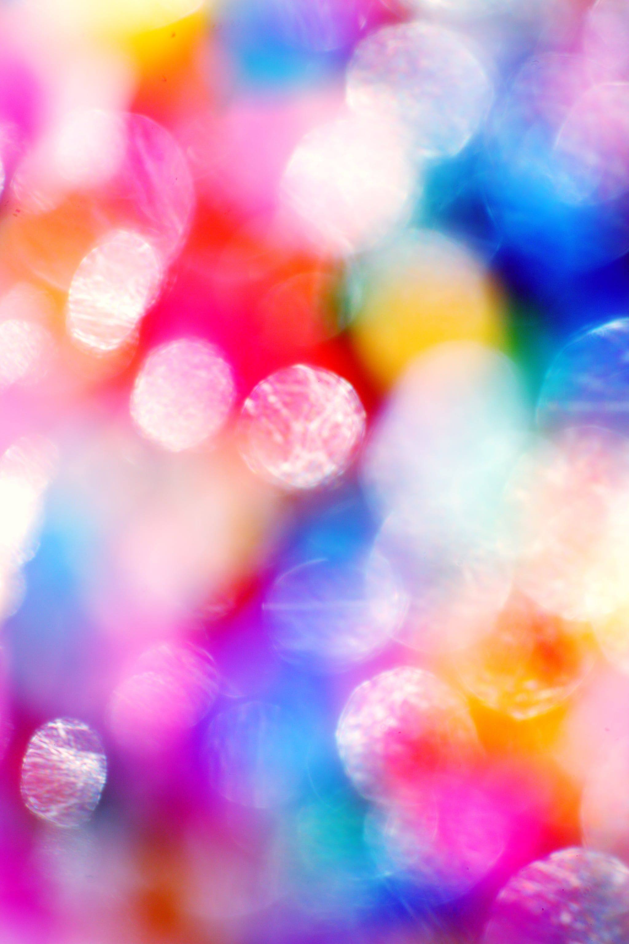 A blurry image of colorful circles - Glitter