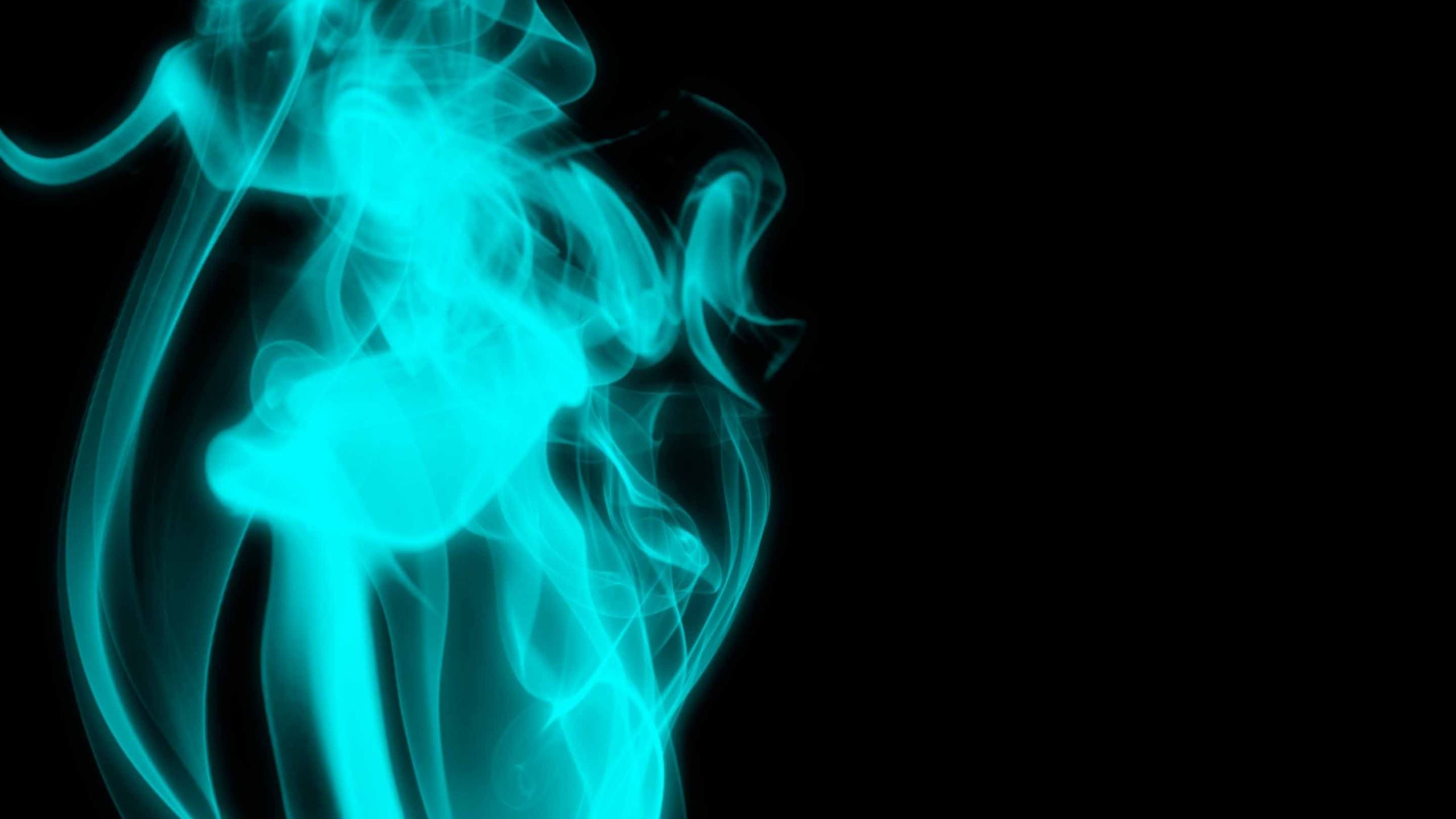 Turquoise smoke on a black background - Smoke