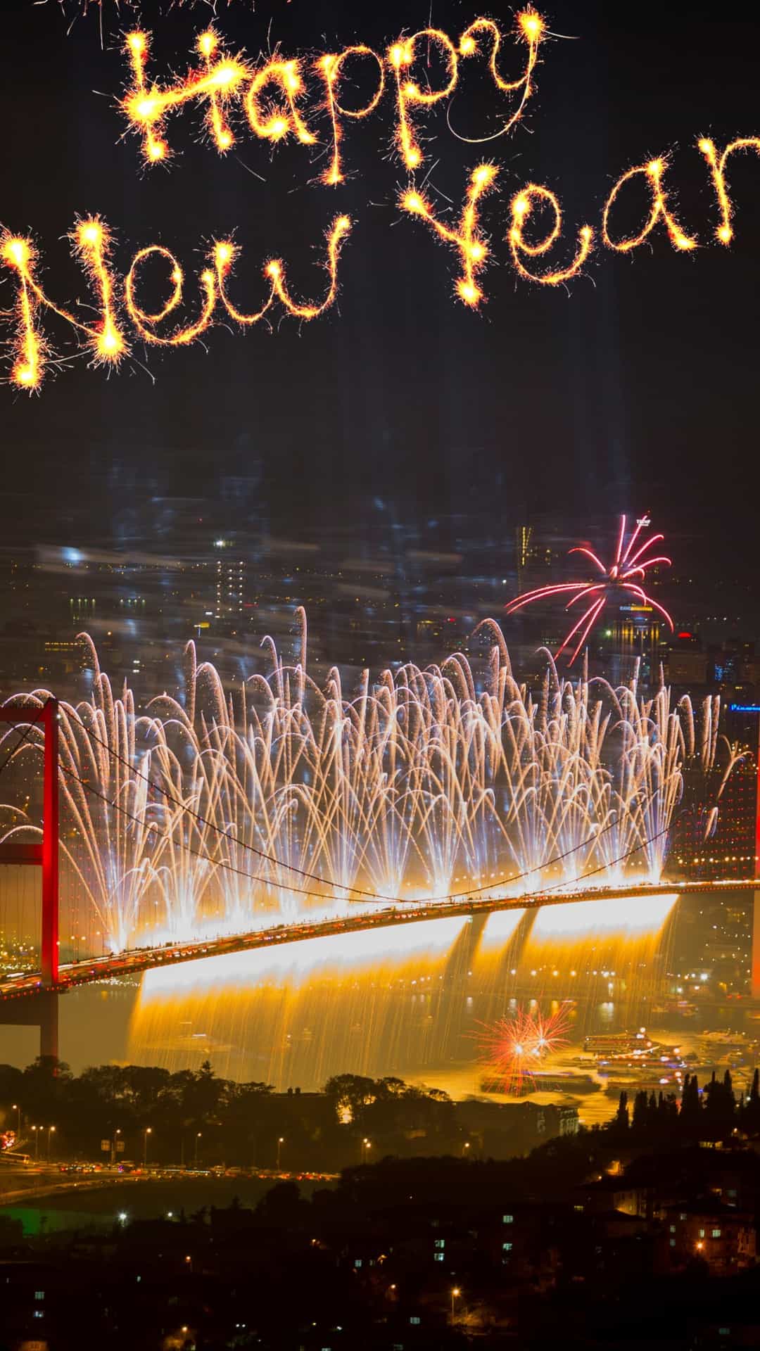 A fireworks display over the bridge and city - New Year