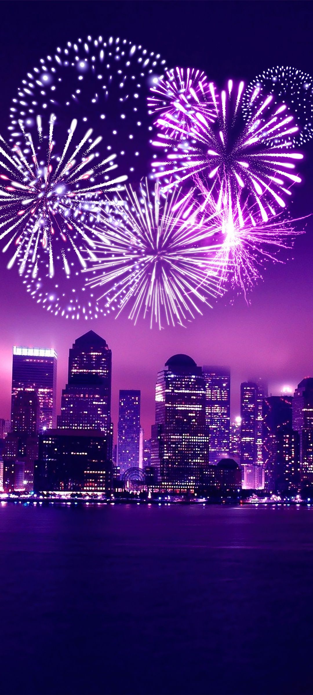 A city skyline with fireworks in the background - New Year
