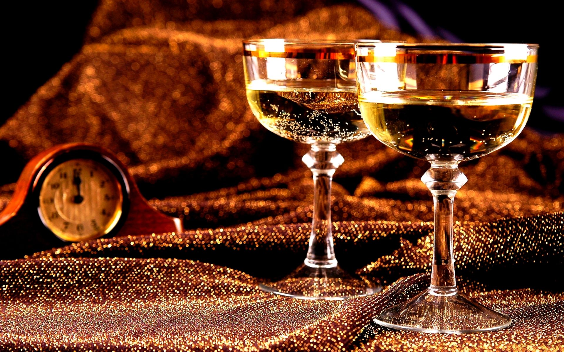 A couple of wine glasses sitting on top - New Year, champagne