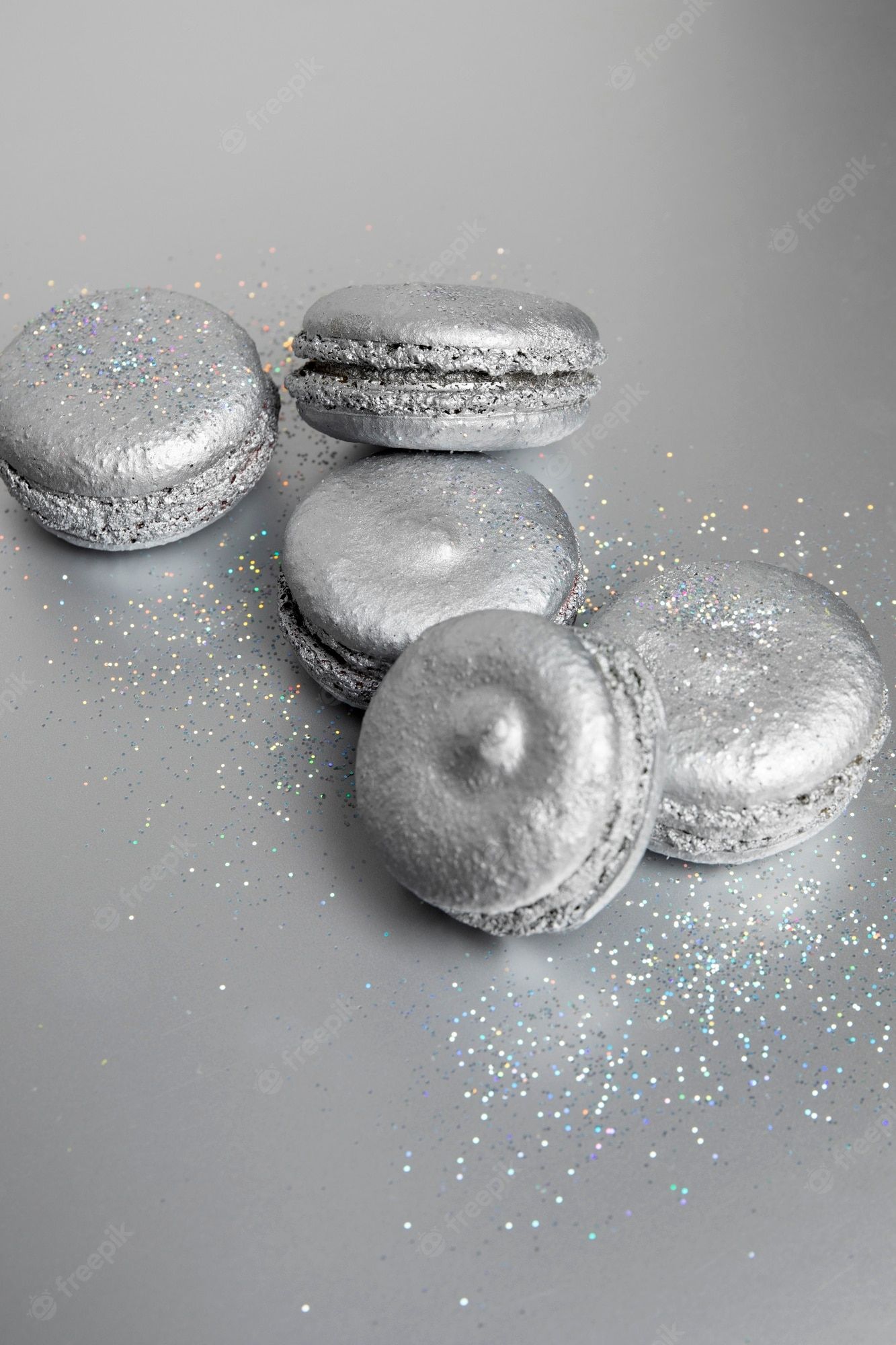 A group of silver macaroons on top - Photography, silver