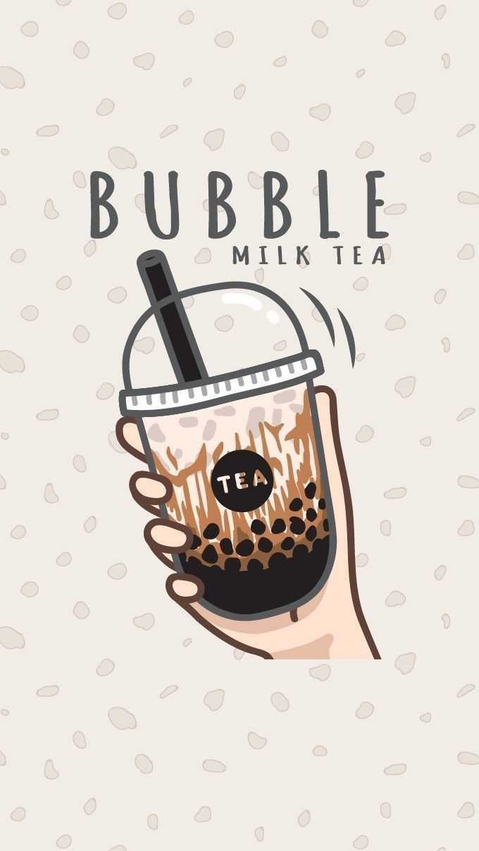 A hand holding a cup of bubble milk tea - Boba