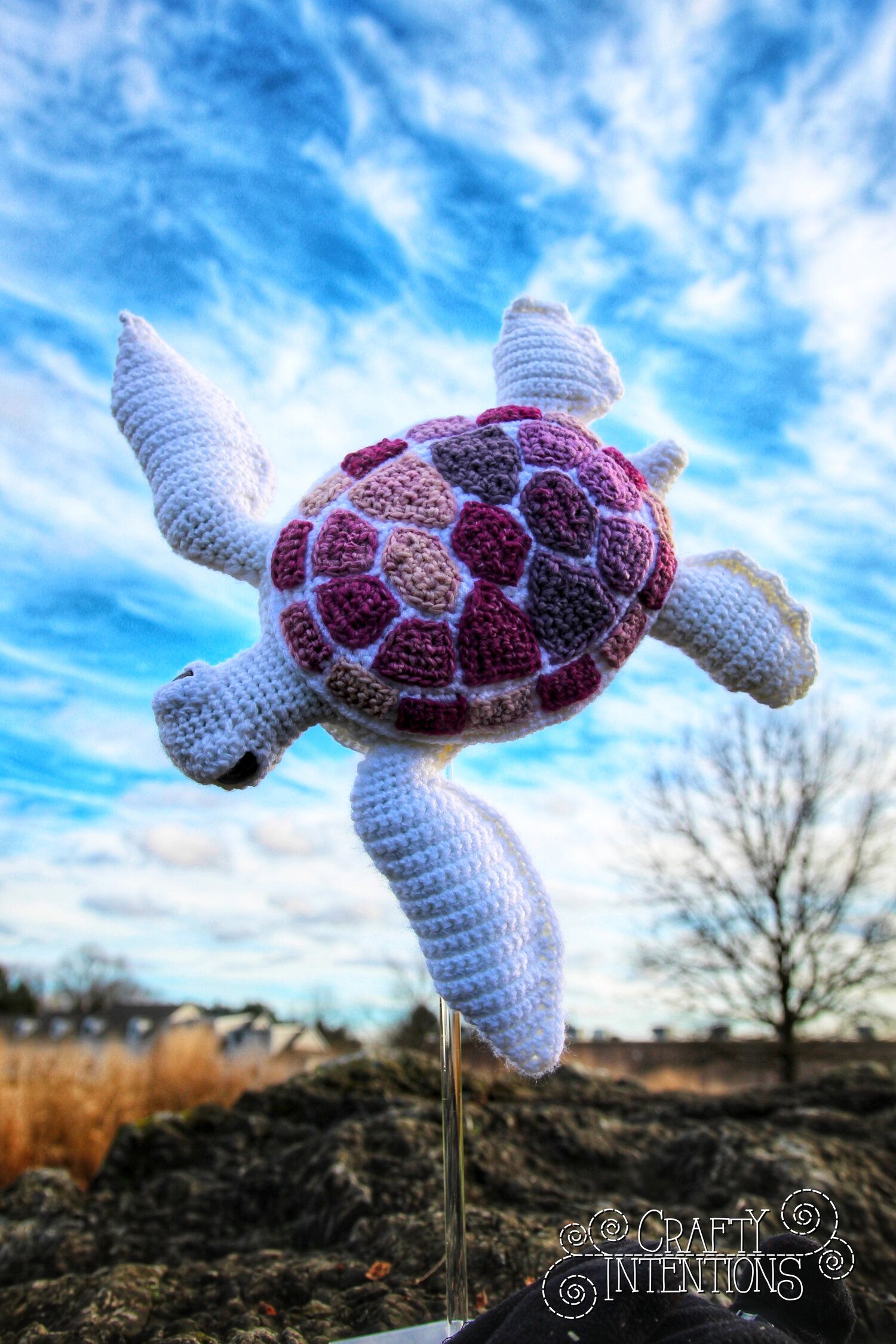 A stuffed animal turtle on top of something - Sea turtle