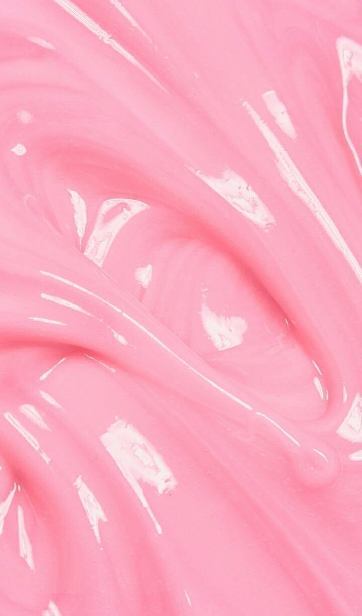 A close up of pink liquid in the shape - Slime