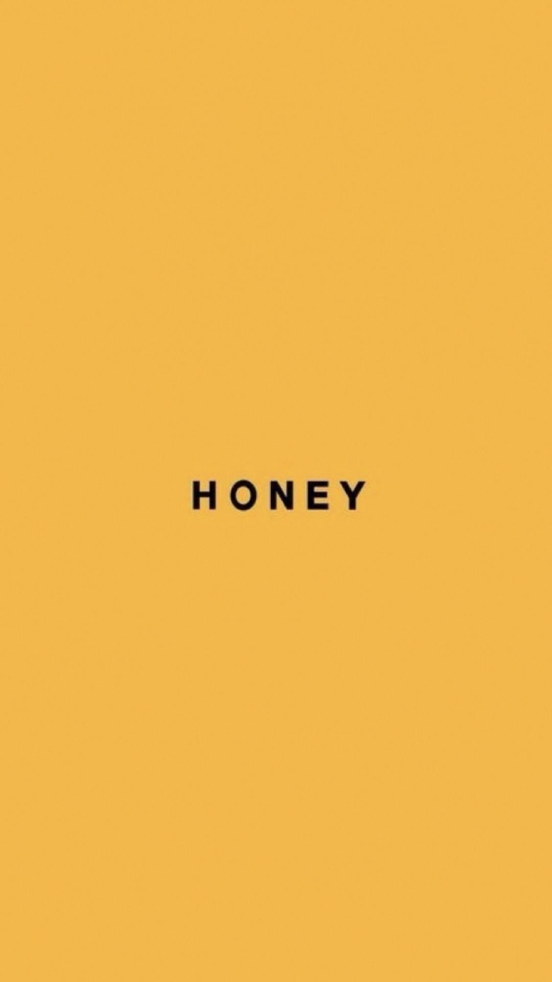 A yellow background with the word honey on it - Honey