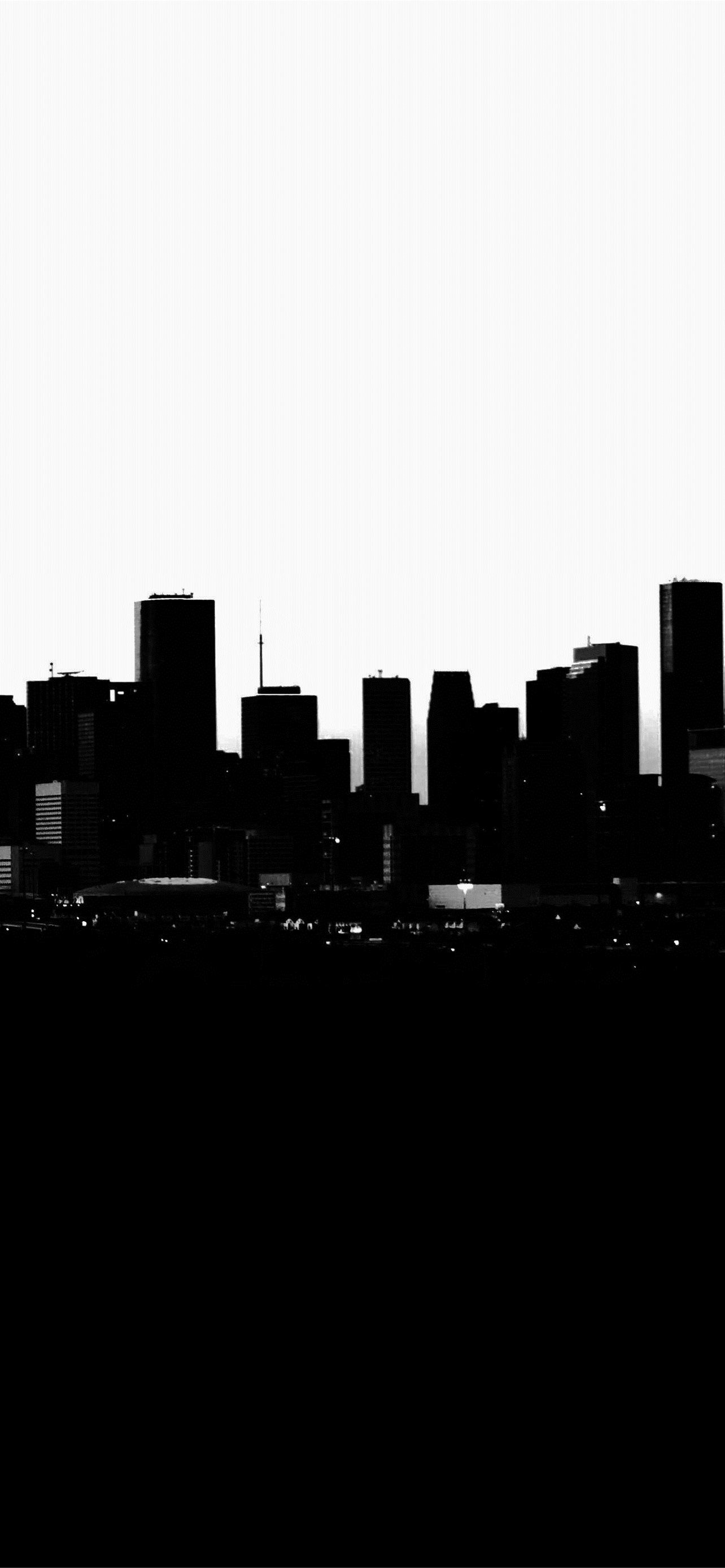 A black and white photo of a city skyline - Texas