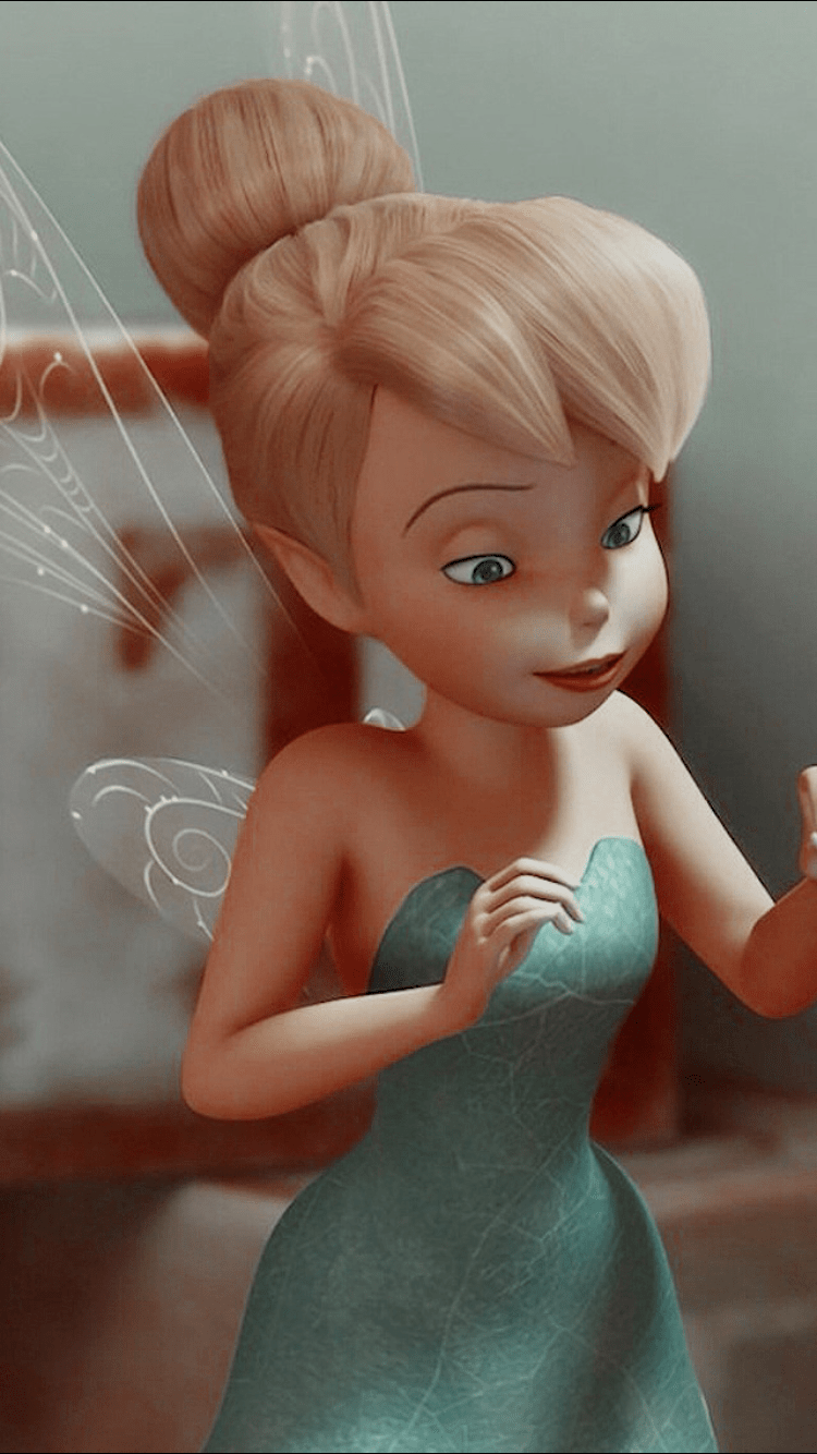 Tinker Bell from Peter Pan with a green dress and blonde hair in a bun - Tinkerbell