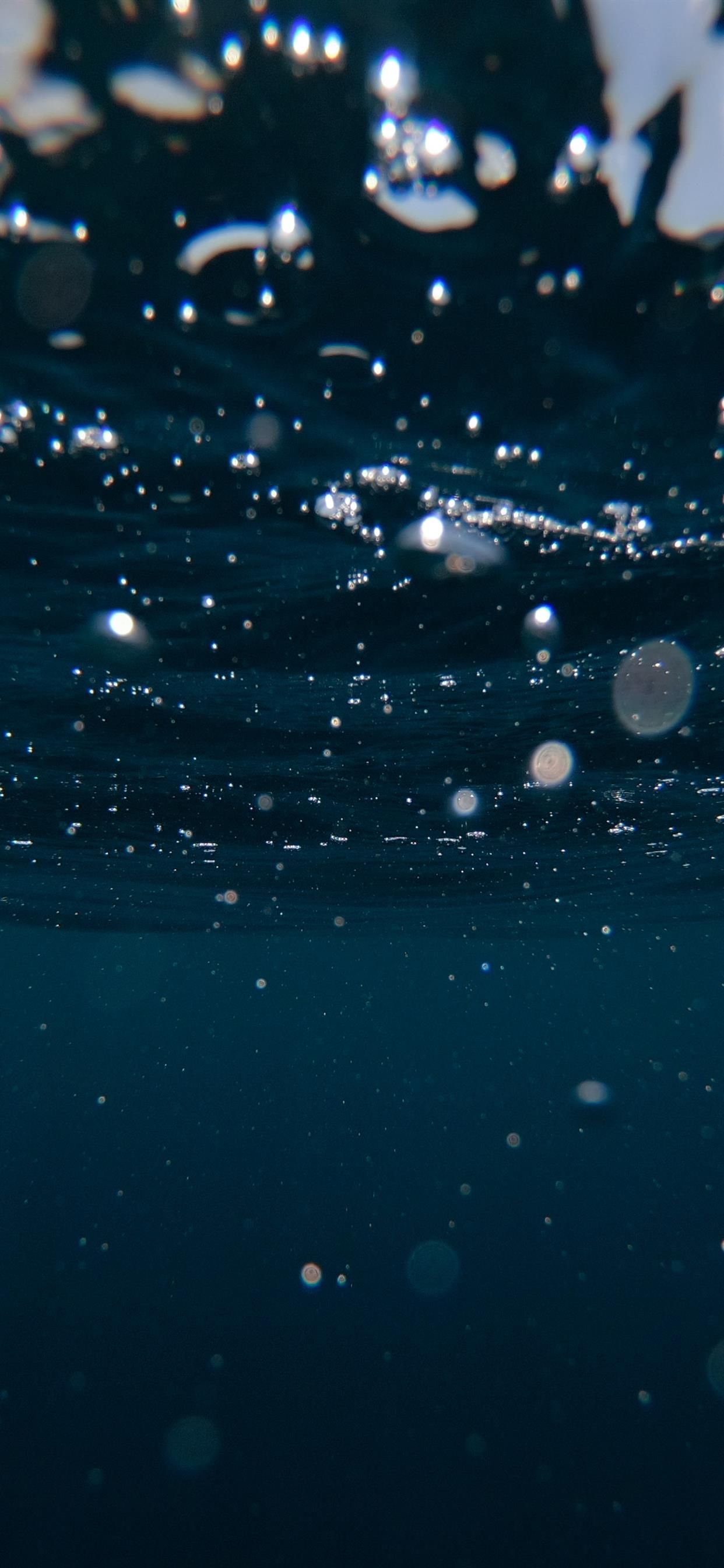 Underwater bubbles in a dark blue sea - Underwater, water