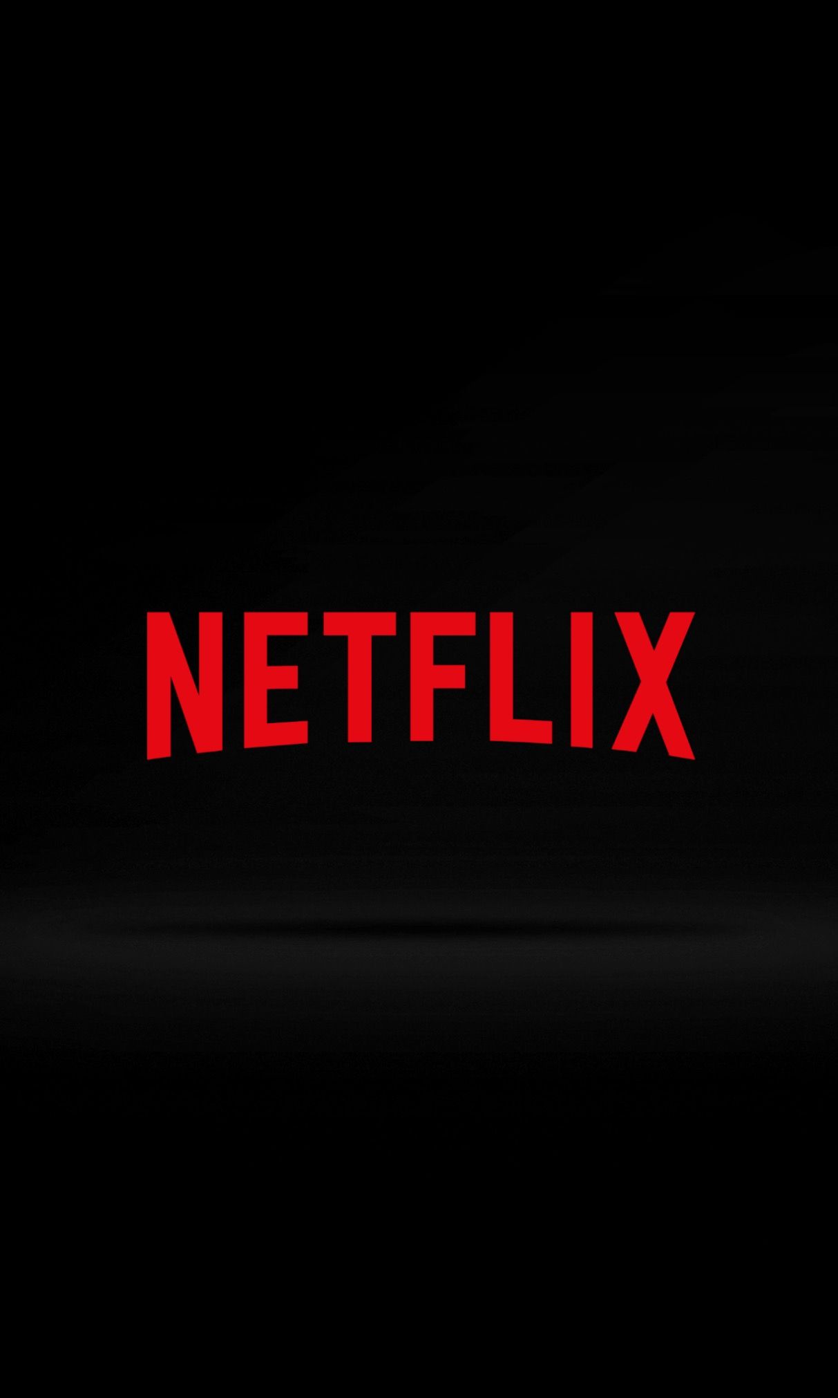 Netflix logo in red on a black background - Netflix
