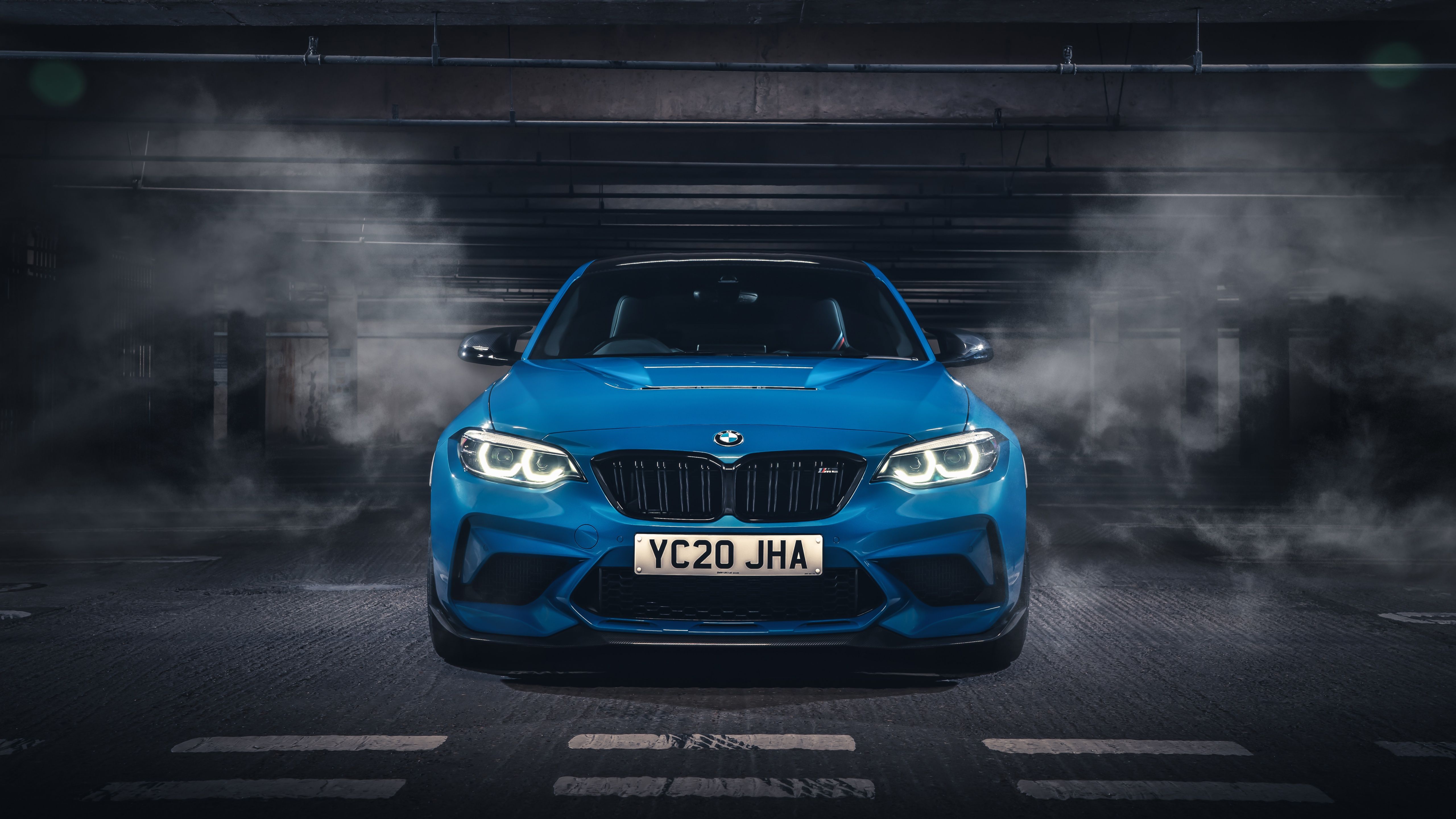 The bmw m2 is parked in a garage - BMW