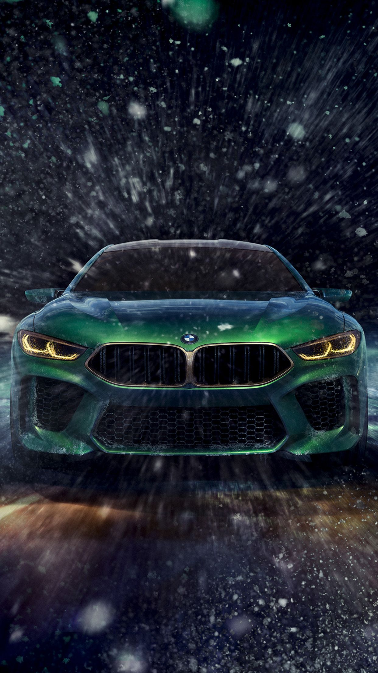 IPhone wallpaper of the BMW M8 Gran Coupe in the snow - BMW