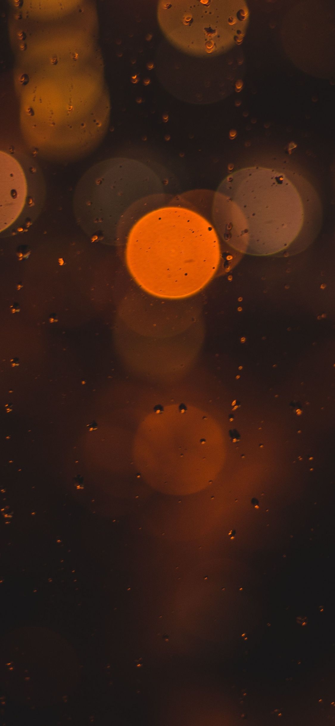 Bokeh lights on a rainy night wallpaper 1242x2688 - Dark orange