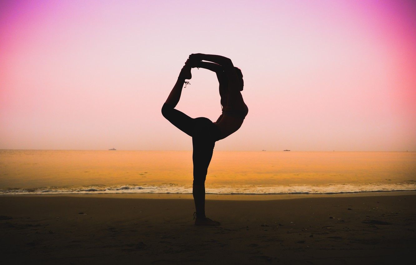 A person doing yoga on the beach - Gymnastics