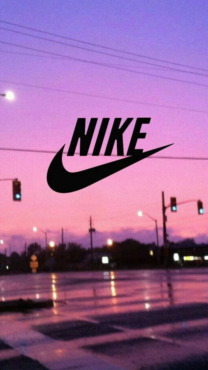 A purple sky with the nike logo on it - Nike