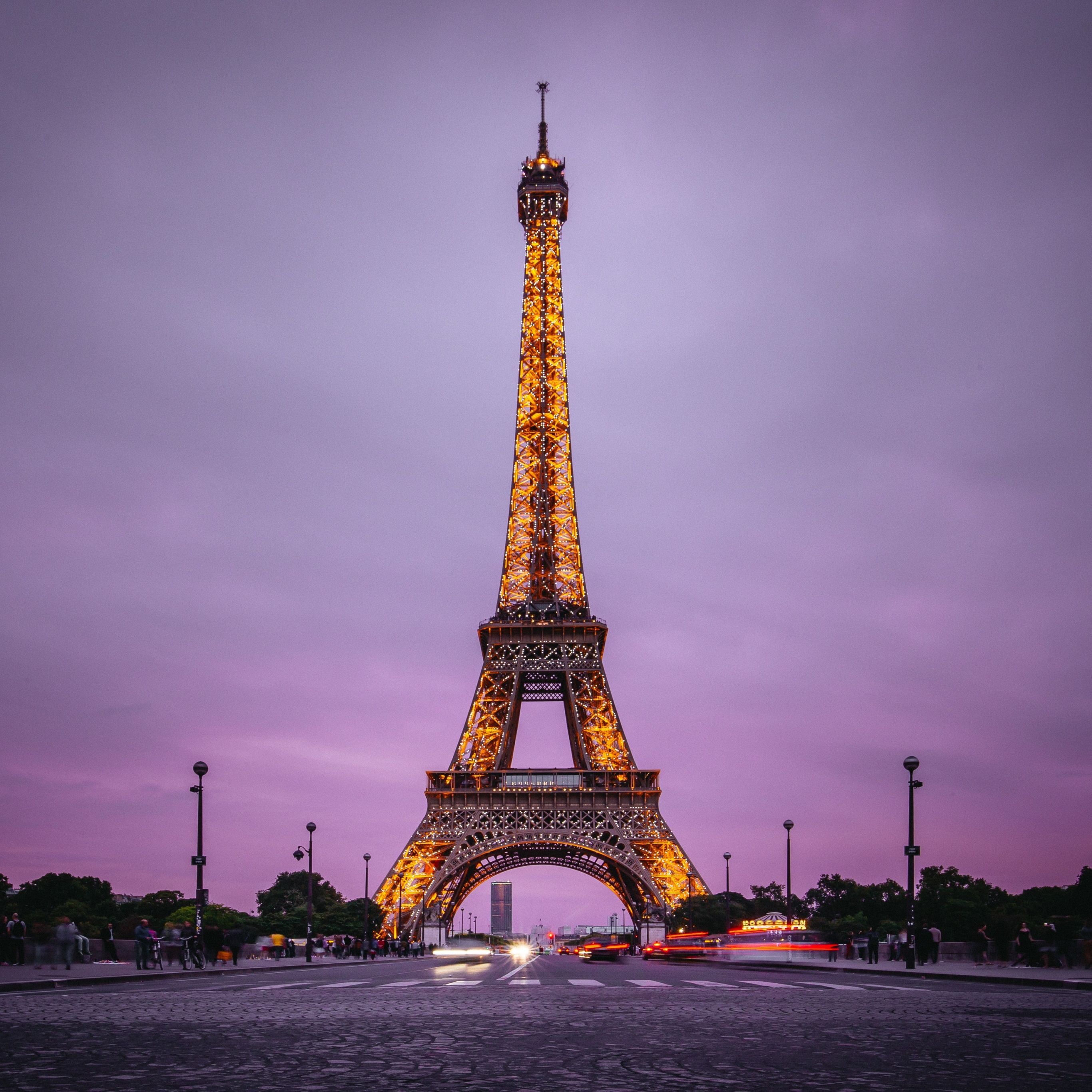 The eiffel tower is lit up at night - Paris, Eiffel Tower