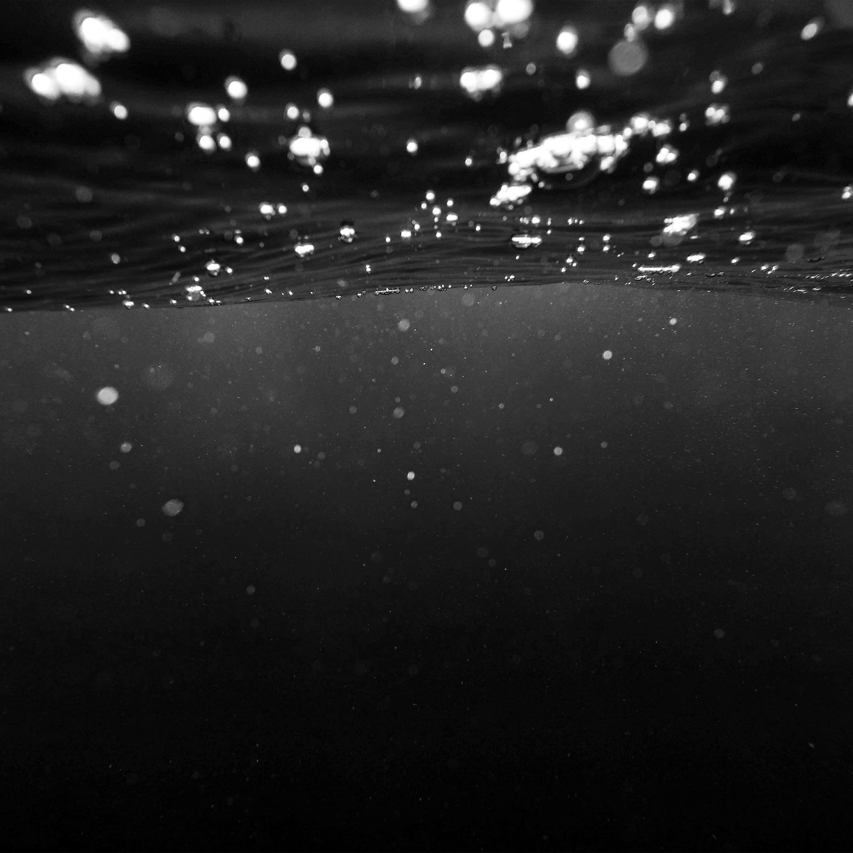 Black and white photo of water with light shining through. - Dark, iPad