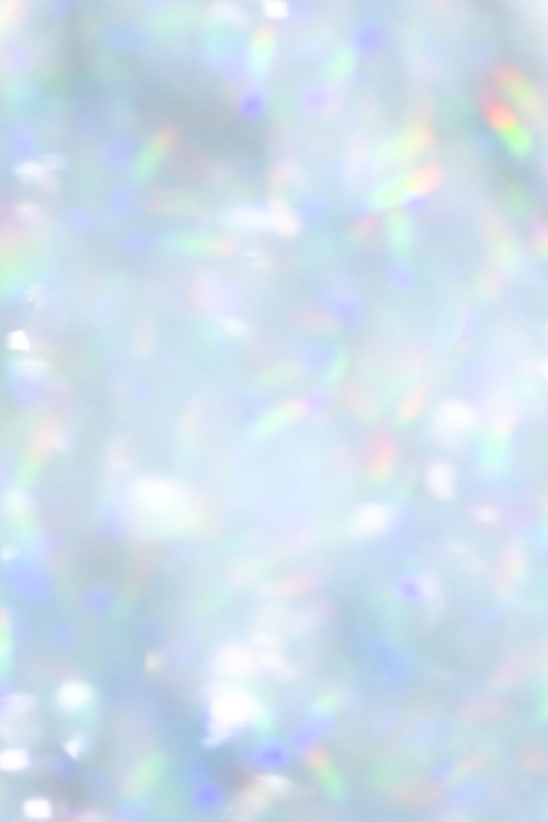 A white holographic background with rainbow refraction - Glitter