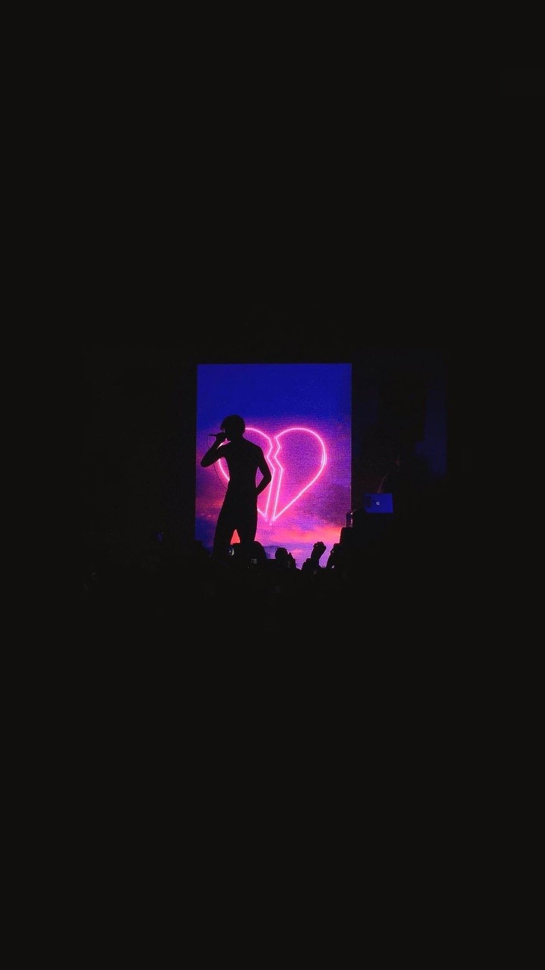 IPhone wallpaper of The Weeknd performing on stage with a neon heart behind him. - Lil Peep