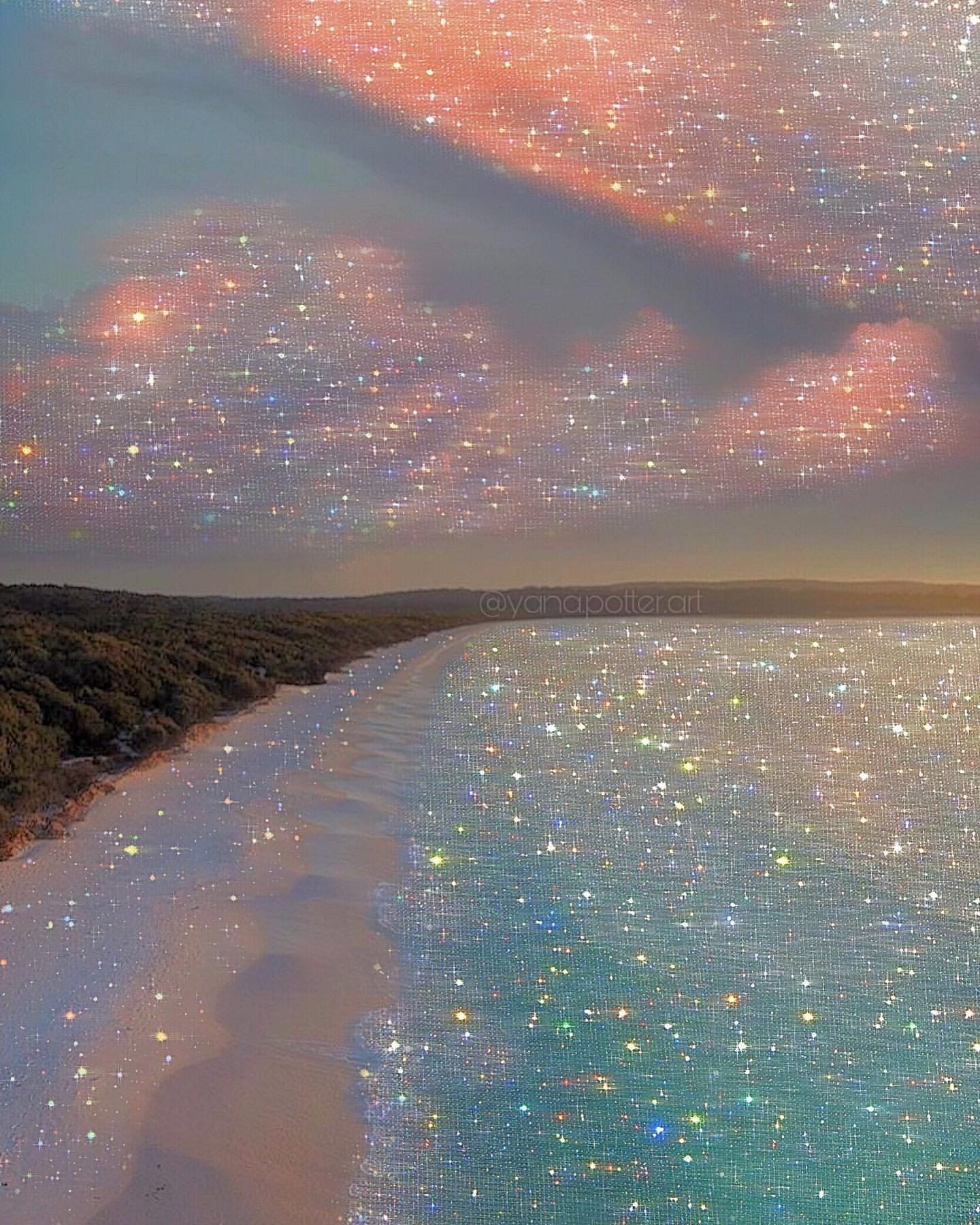 A beach with some sparkling lights in the sky - Glitter
