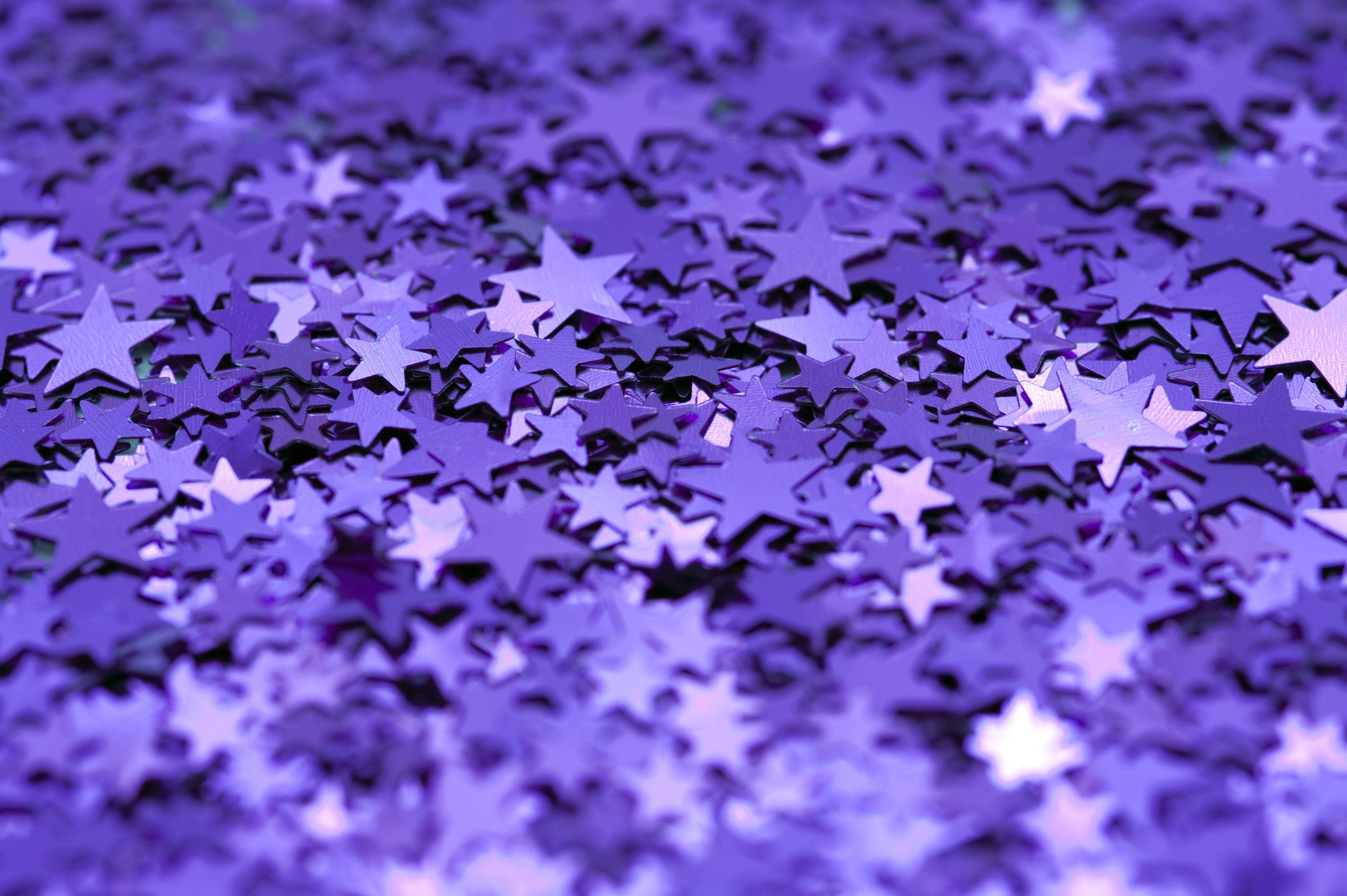 Purple stars background with copy space. - Glitter