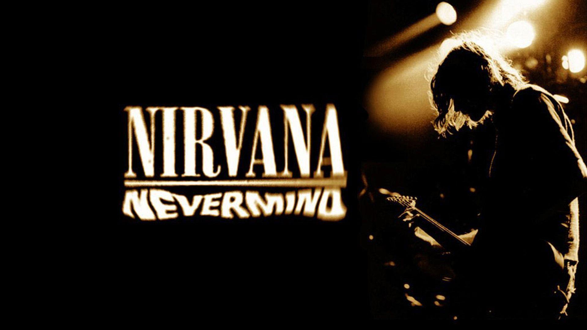 The Nirvana Nevermind album cover with a silhouette of a man playing guitar in the foreground. - Nirvana