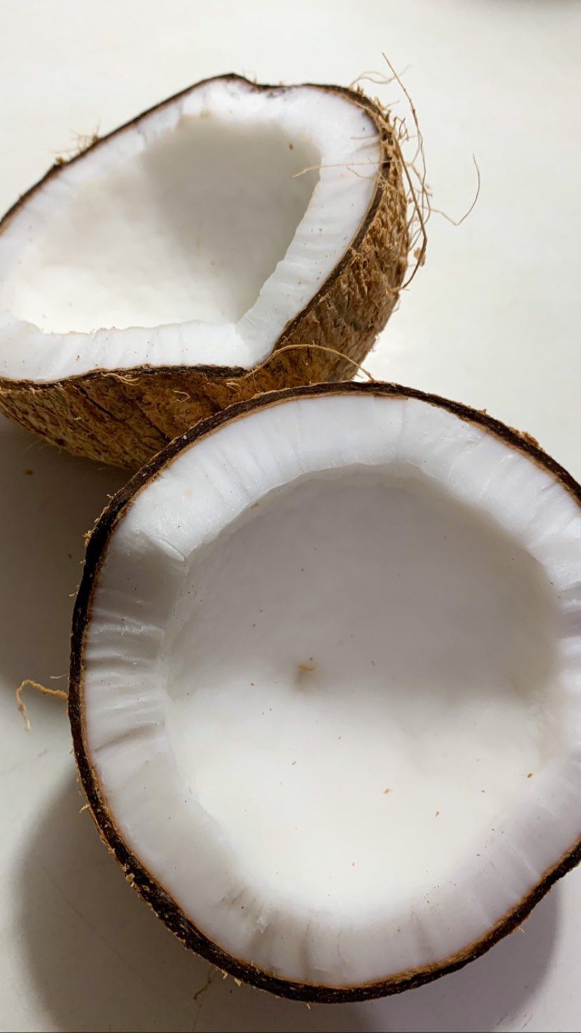 A coconut that has been split in half - Coconut