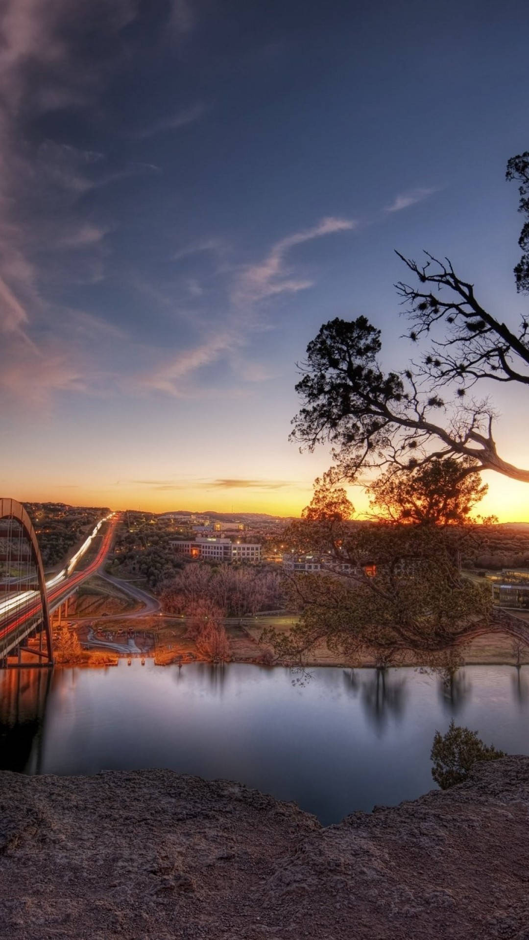 The 360 Bridge in Austin, Texas, with a sunset in the background. - Texas
