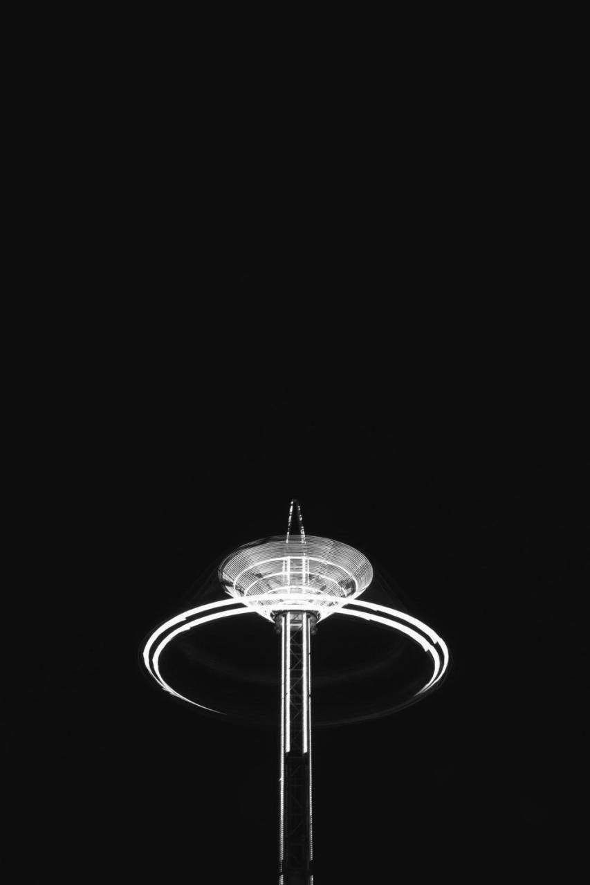 A black and white photo of a carousel - Black