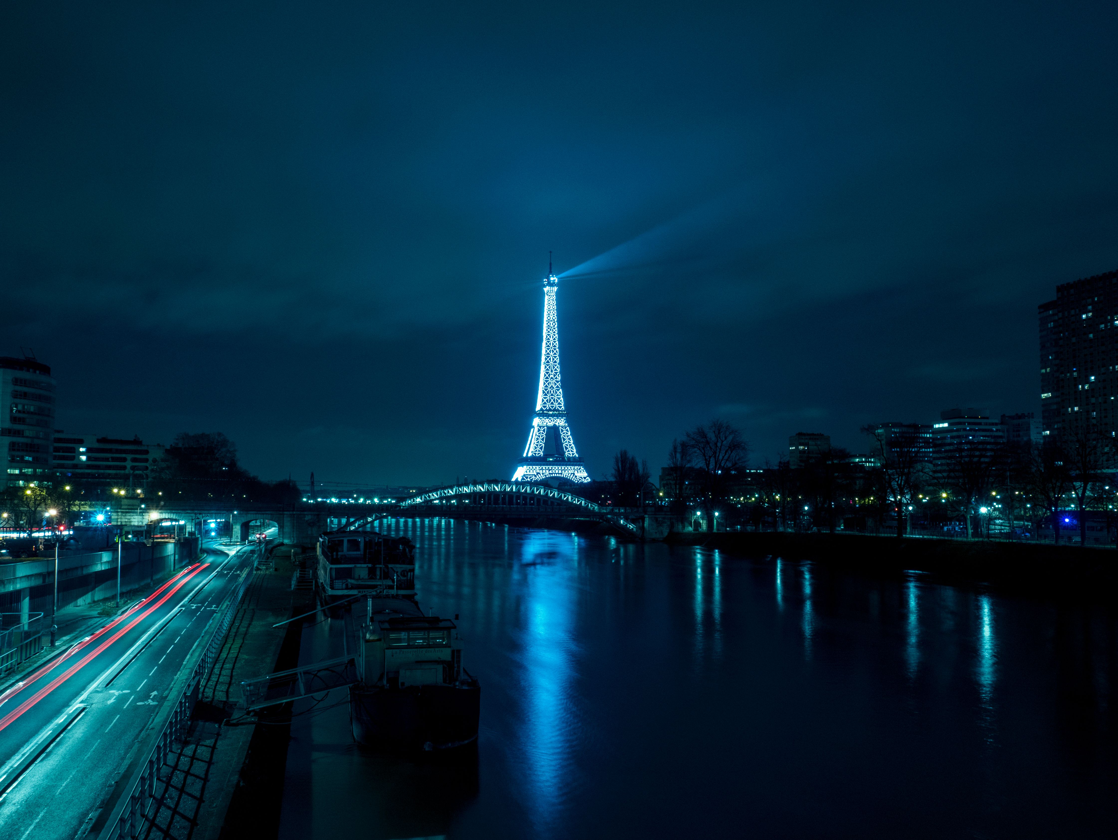 A city at night with the eiffel tower in it - Paris, France
