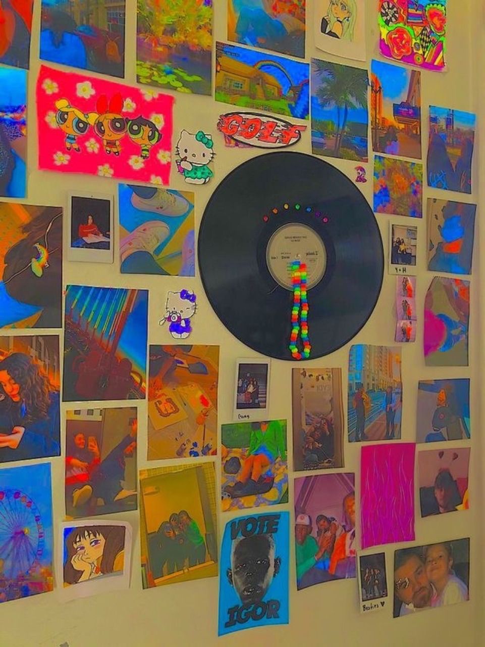 A wall covered in photos and a vinyl record. - Indie