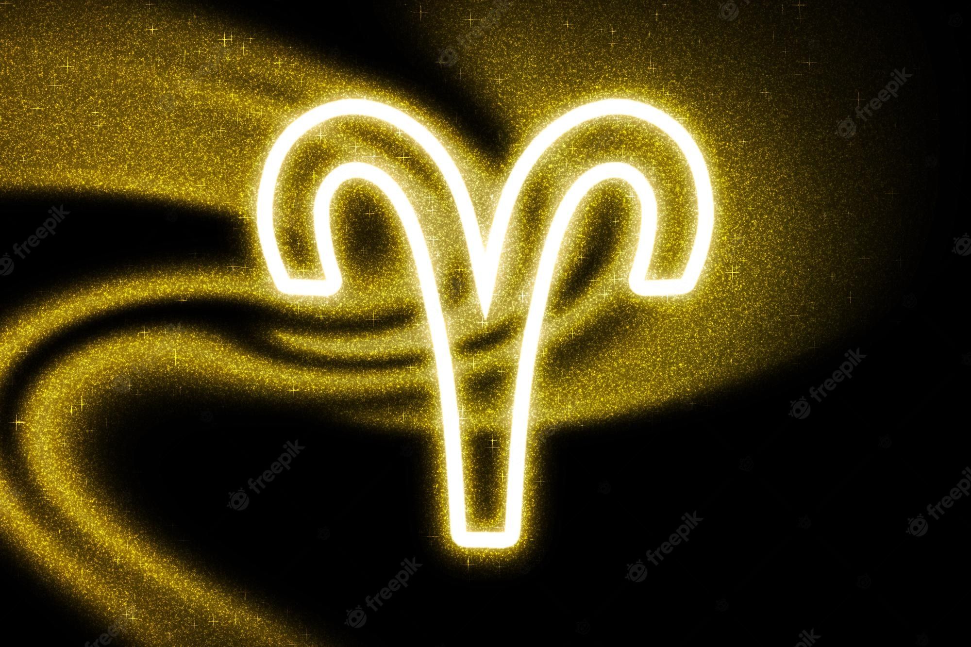 Aries zodiac sign in yellow neon on a black background - Aries